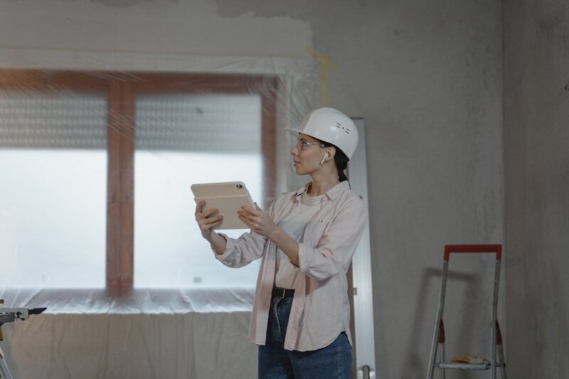 Homeowner reviewing construction project updates on a mobile device
