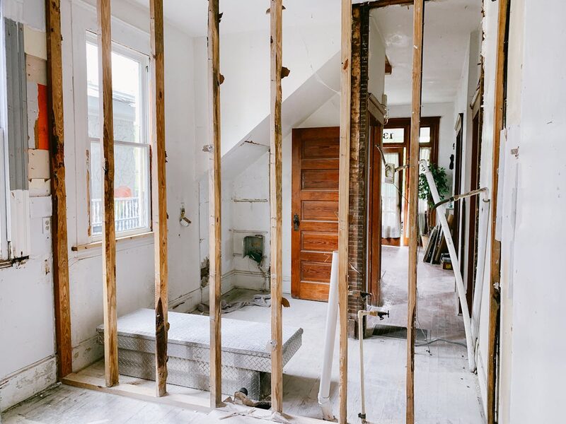 Interior of a garage being converted to an ADU showing framing and insulation work