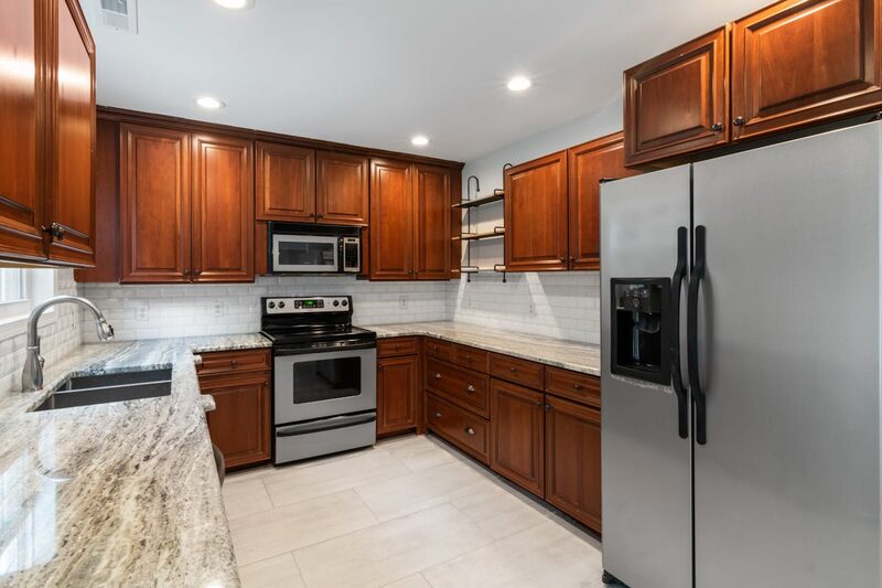Modern kitchen remodel in progress showing cabinet installation