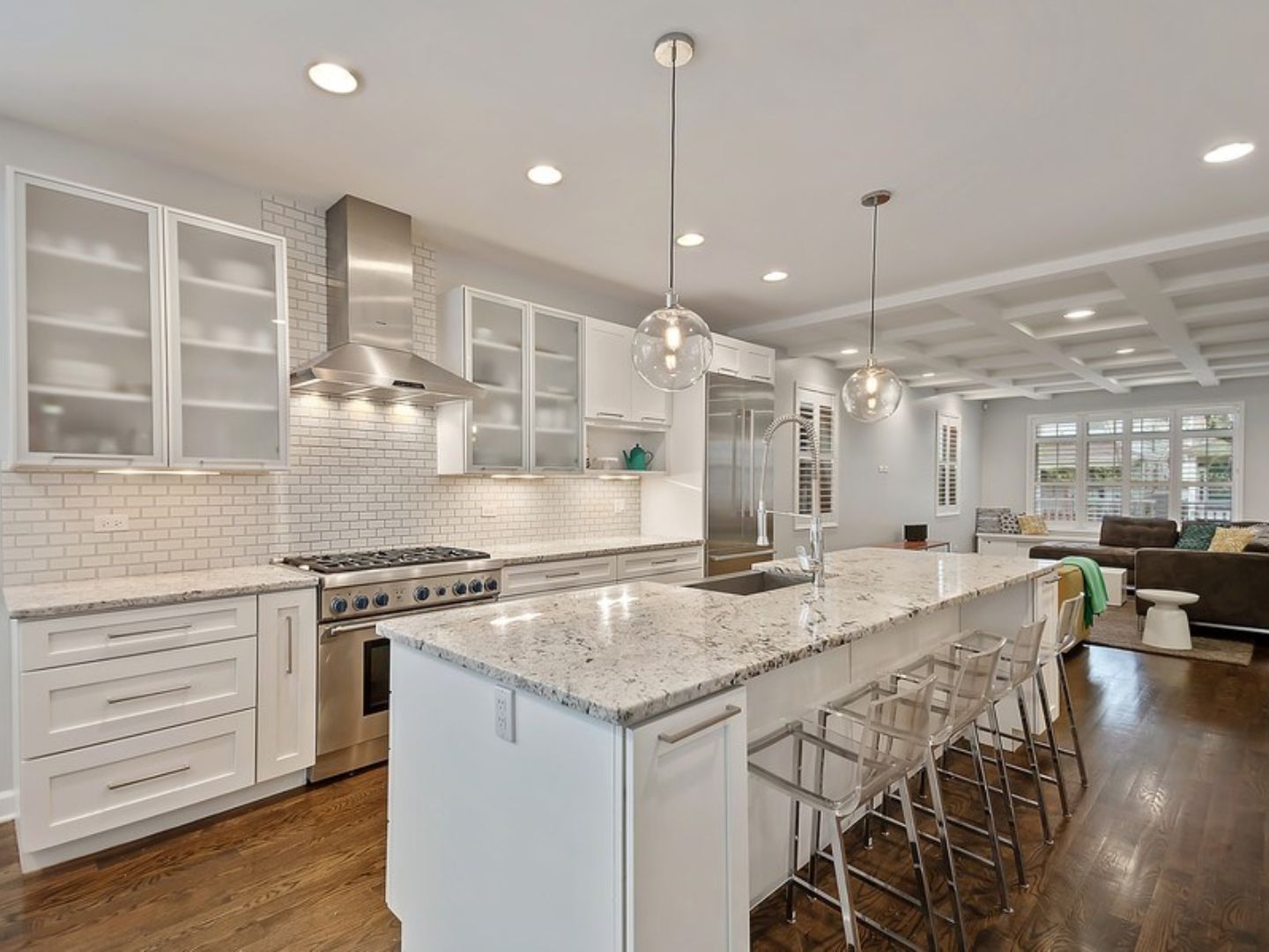 White kitchen remodel with island open to living room in Bay Area home