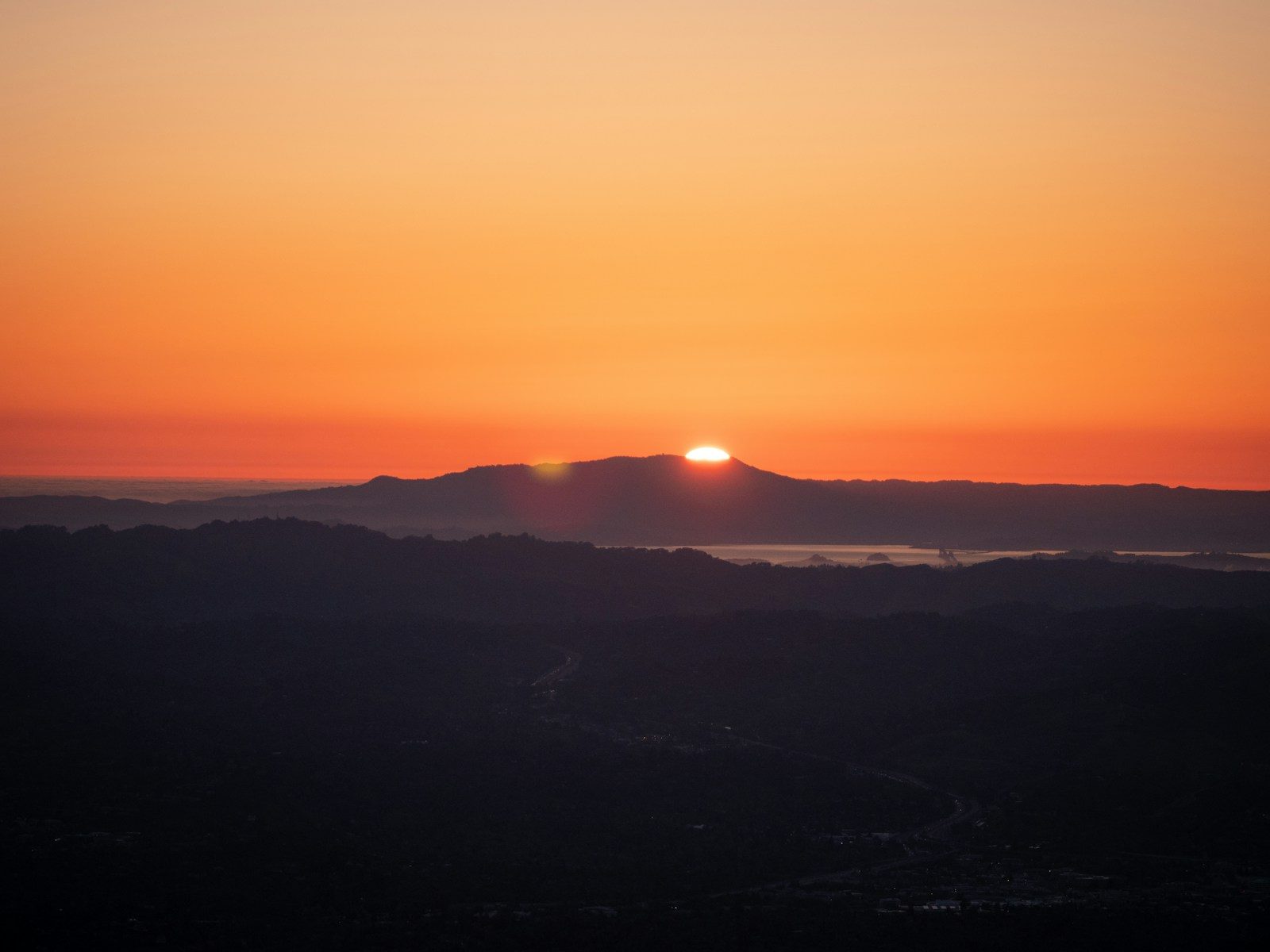 Mount Diablo at sunset with golden sky over Contra Costa County East Bay hills